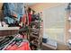 Organized walk-in closet featuring metal shelving and a variety of clothing and accessories at 15 Fairwoods Ct, Covington, GA 30016