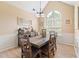 Bright dining room with a large window and chandelier at 15 Fairwoods Ct, Covington, GA 30016