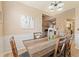 Charming dining room with rustic wood table and seating for six at 15 Fairwoods Ct, Covington, GA 30016