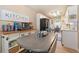 Eat-in kitchen area with breakfast table adjacent to the stainless steel appliances at 15 Fairwoods Ct, Covington, GA 30016