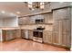 Kitchen featuring stainless steel appliances, wooden cabinets and hardwood floors at 2930 Torreya Way # 2930, Marietta, GA 30067