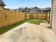 Fenced backyard featuring a concrete patio and small grassy area at 324 Stoney Hollow Rd, Canton, GA 30114