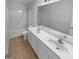 Bathroom with a double sink vanity and tub-shower combo at 324 Stoney Hollow Rd, Canton, GA 30114