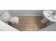 Compact bathroom with neutral tile flooring, pedestal sink, and standard toilet at 324 Stoney Hollow Rd, Canton, GA 30114