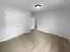 Bright bedroom with neutral carpet, double-door closet and a smooth ceiling at 324 Stoney Hollow Rd, Canton, GA 30114