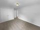 Bright bedroom featuring a closet with double doors and neutral carpeting at 324 Stoney Hollow Rd, Canton, GA 30114