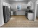 Clean kitchen with stainless steel appliances and white cabinets at 324 Stoney Hollow Rd, Canton, GA 30114