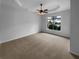 Spacious bedroom with tray ceiling, ceiling fan, and view from the window at 324 Stoney Hollow Rd, Canton, GA 30114