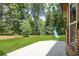 Spacious backyard with lush green grass, a swing set, slide, and ample room for outdoor activities at 538 Mulberry Fern Dr, Auburn, GA 30011