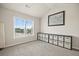 Bedroom featuring large window offering natural light and built-in storage shelves at 538 Mulberry Fern Dr, Auburn, GA 30011