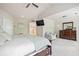 Spacious bedroom with a tv, ensuite bathroom access and walk-in closet at 538 Mulberry Fern Dr, Auburn, GA 30011