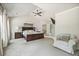 Bright bedroom with vaulted ceiling, lots of natural light, sitting area and hardwood floors at 538 Mulberry Fern Dr, Auburn, GA 30011