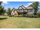 Stunning home featuring a stone and brick exterior, well-manicured lawn, and charming curb appeal at 538 Mulberry Fern Dr, Auburn, GA 30011