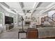 Bright living room with large windows, coffered ceiling, brick fireplace, and built-in shelving at 538 Mulberry Fern Dr, Auburn, GA 30011