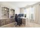 Bright and spacious home office with built-in shelving, offering an organized and productive workspace at 538 Mulberry Fern Dr, Auburn, GA 30011