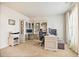 Well-lit home office featuring built-in shelving, dual desks, and a large window for natural light at 538 Mulberry Fern Dr, Auburn, GA 30011