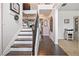 Elegant staircase featuring wood treads and iron spindles, leading to the upper level of the home at 538 Mulberry Fern Dr, Auburn, GA 30011