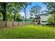 A large backyard provides ample space for outdoor activities; house has a second story deck at 833 Humphries Sw St, Atlanta, GA 30310