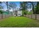 Spacious backyard with a modern two-story house, providing ample room for outdoor activities and gardening at 833 Humphries Sw St, Atlanta, GA 30310