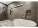Modern bathroom showcasing a free-standing tub, shower, and contemporary fixtures at 833 Humphries Sw St, Atlanta, GA 30310