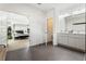 Bathroom with double vanity leading to bedroom with four poster bed at 833 Humphries Sw St, Atlanta, GA 30310