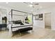 Light and bright bedroom with four poster bed and wood floors at 833 Humphries Sw St, Atlanta, GA 30310