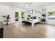 Spacious bedroom with a canopy bed, hardwood floors, and large windows at 833 Humphries Sw St, Atlanta, GA 30310