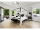 Bedroom with four poster bed and deck access at 833 Humphries Sw St, Atlanta, GA 30310