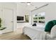Bright bedroom with ample natural light, large windows, stylish accents, and a comfortable bed topped with fresh linens at 833 Humphries Sw St, Atlanta, GA 30310