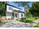 Modern two-story home with a concrete driveway and a well-manicured lawn at 833 Humphries Sw St, Atlanta, GA 30310