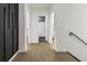 Bright hallway with wood floors and doorways leading to various rooms at 833 Humphries Sw St, Atlanta, GA 30310