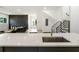 Open kitchen layout with a large marble countertop island and sleek sink at 833 Humphries Sw St, Atlanta, GA 30310
