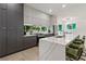 Modern kitchen with a large island featuring barstool seating, stainless steel appliances, and sleek cabinetry at 833 Humphries Sw St, Atlanta, GA 30310