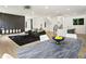 Open-concept living room and dining area with sleek hardwood floors and modern decor at 833 Humphries Sw St, Atlanta, GA 30310