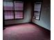 Bedroom with carpeted floors and natural light from two windows at 1643 Westhaven Sw Dr, Atlanta, GA 30311