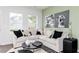 Comfortable and bright living room featuring lots of seating and natural light at 2686 Brookview Nw Ln, Atlanta, GA 30318