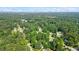 Scenic aerial shot of a neighborhood with homes nestled amongst lush green trees at 340 Windsor Se Walk, Conyers, GA 30094
