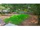Large backyard with a green lawn and a wooden fence at 340 Windsor Se Walk, Conyers, GA 30094