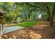 Large backyard with grassy area, concrete pad, and a wood fence surrounding the perimeter at 340 Windsor Se Walk, Conyers, GA 30094