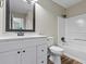 Clean bathroom with shower and tub combination, single sink vanity, and new finishes at 340 Windsor Se Walk, Conyers, GA 30094