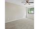 Bedroom with neutral walls, carpet, large window, and ceiling fan at 340 Windsor Se Walk, Conyers, GA 30094