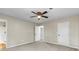 Bedroom with neutral walls, carpet, ceiling fan and two doors at 340 Windsor Se Walk, Conyers, GA 30094