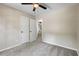 Bedroom with neutral walls, carpet, ceiling fan and two doors at 340 Windsor Se Walk, Conyers, GA 30094