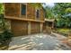 Two-story wood house with a two-car garage and a stone foundation at 340 Windsor Se Walk, Conyers, GA 30094