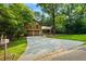 Two-story wood house with a two-car garage and a long driveway at 340 Windsor Se Walk, Conyers, GA 30094