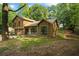 Charming two-story home with wood siding, large windows, front porch, and an attached two-car garage at 340 Windsor Se Walk, Conyers, GA 30094