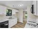 Updated kitchen with white cabinets, granite countertops, and modern appliances at 340 Windsor Se Walk, Conyers, GA 30094