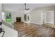 Spacious living room with beautiful vinyl floors, stone fireplace, and large windows at 340 Windsor Se Walk, Conyers, GA 30094