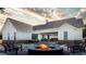 Outdoor living space with a fire pit, chairs, and a covered patio, perfect for entertaining at 1290 Jack Page Ln, Canton, GA 30115