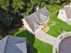 Aerial view showcases landscaping, backyard, and driveway of well-maintained home in a cul-de-sac at 1343 Cartwright Ln, Lawrenceville, GA 30045
